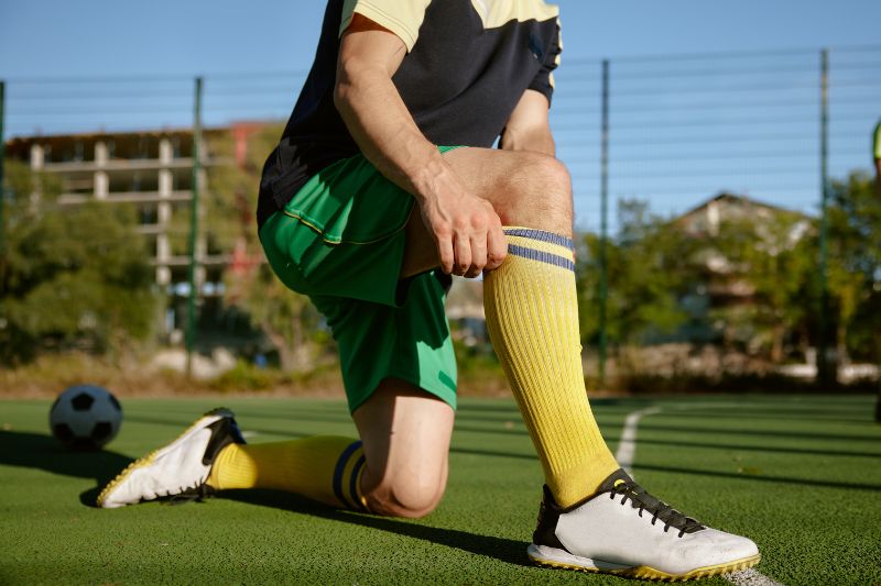 Why Do Football Players Wear Long Socks? The Benefits Explained