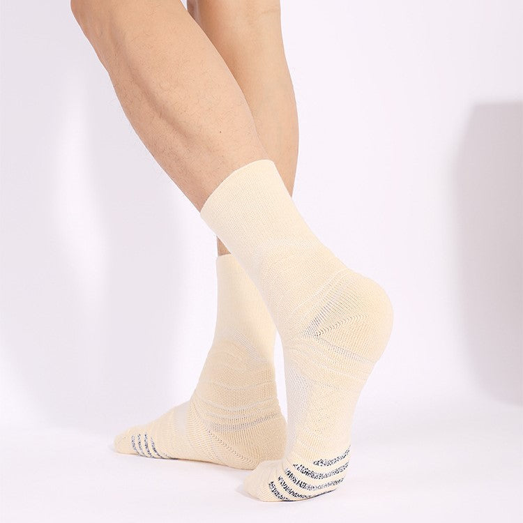 A Man Wearing The Hywell Beige Full Support Cushioned Basketball Crew Socks