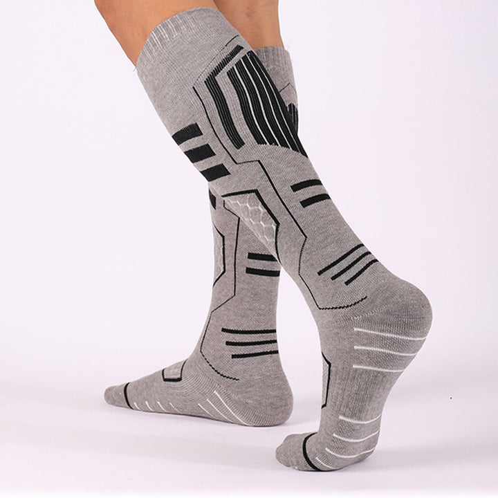 A man wearing gray Merino Wool Cushioned Warm Skiing Over The Calf Socks