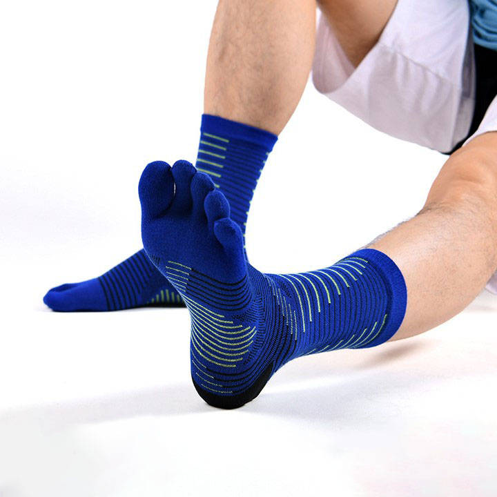Athlete wearing blue anti blister toe socks, ideal for preventing friction and improving foot flexibility during training.
