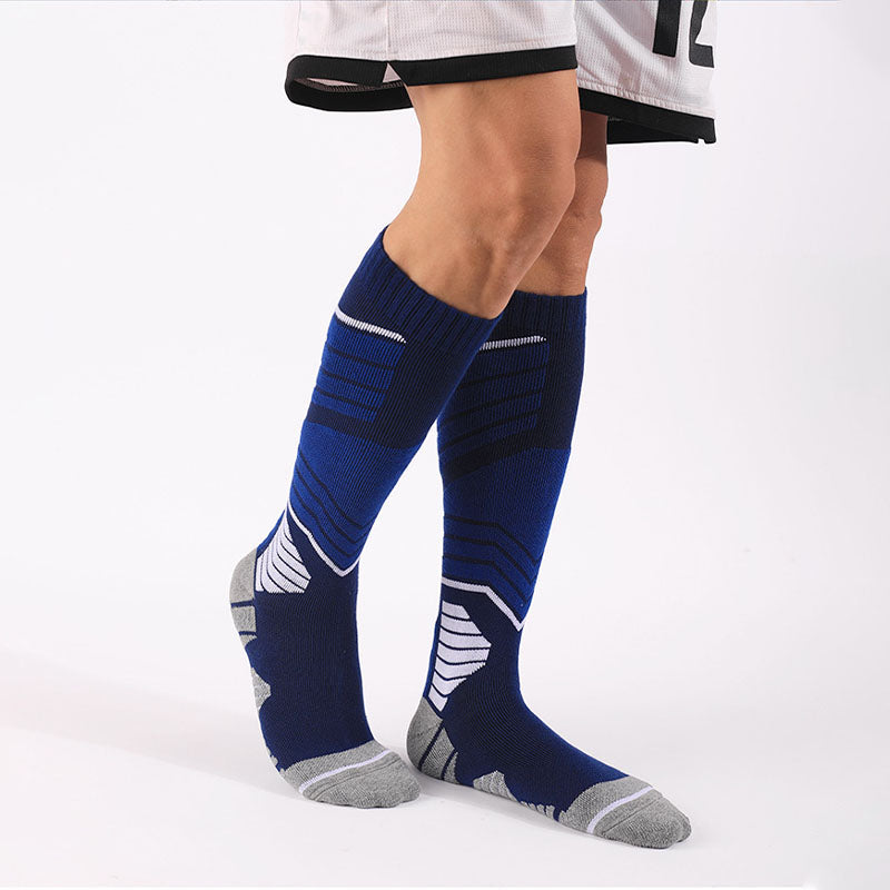 Athlete wearing blue thick padded skiing over the calf socks, ideal for cold weather sports