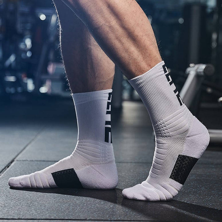 Athlete wearing white fitness socks during a workout, designed for stability and impact absorption.