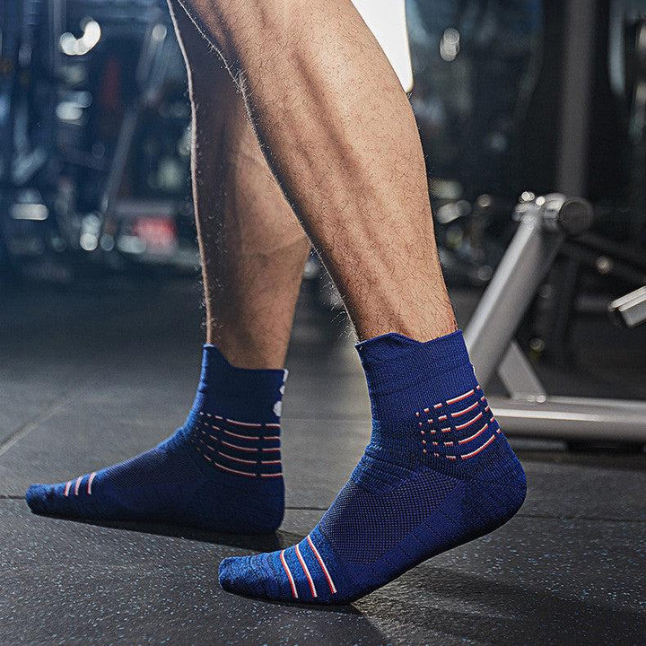 Blue fitness socks worn during a workout, designed for comfort, stability, and sweat control.