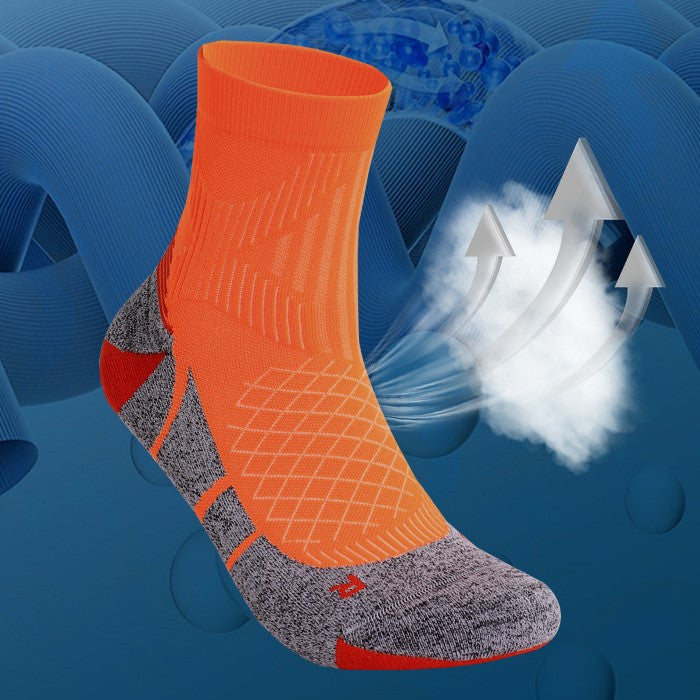 Bright orange cushioned tennis socks with a cushioned footbed, offering comfort and support for long tennis sessions.