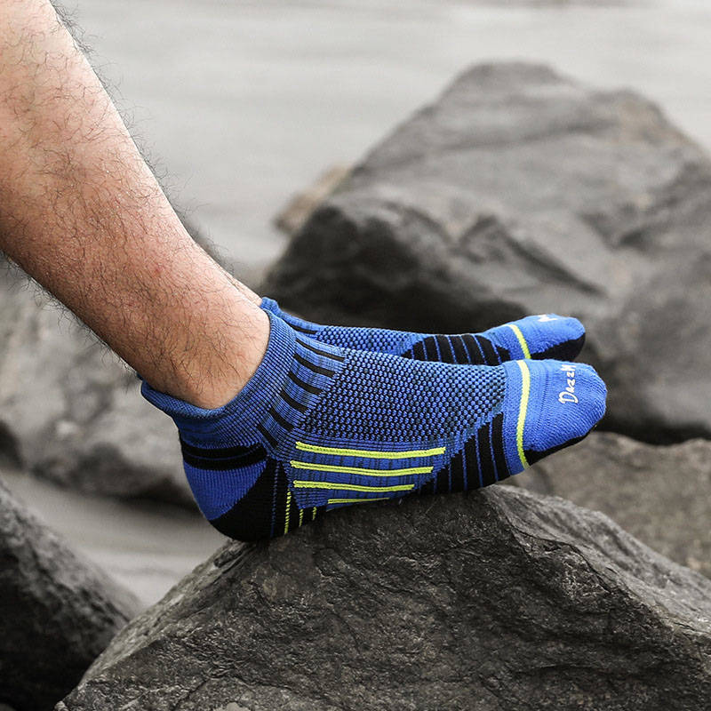 Close-up of blue compression running socks with added support for running and active workouts.