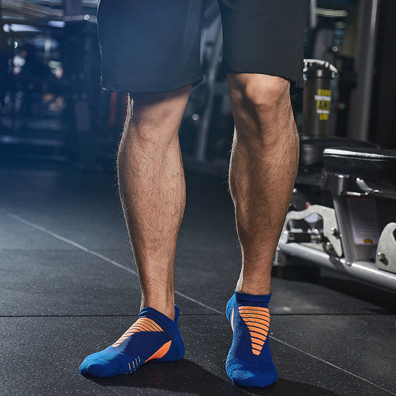 Close-up of blue thick padded running socks providing stability and comfort during runs.