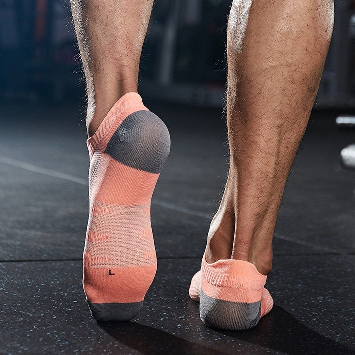 Low cut men's workout socks worn during gym training session