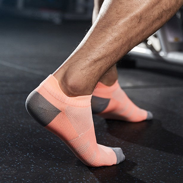 Men's workout socks providing heel support during squats