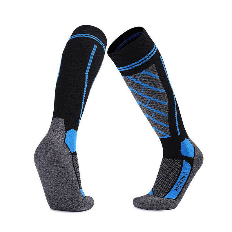 Merino Wool Over The Calf Skiing Socks in black with blue accents, moisture-wicking and supportive for skiers
