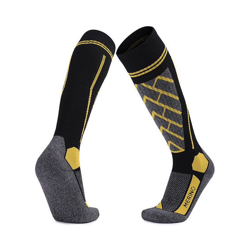 Merino Wool Over The Calf Skiing Socks in black with yellow details, insulating and durable for cold weather
