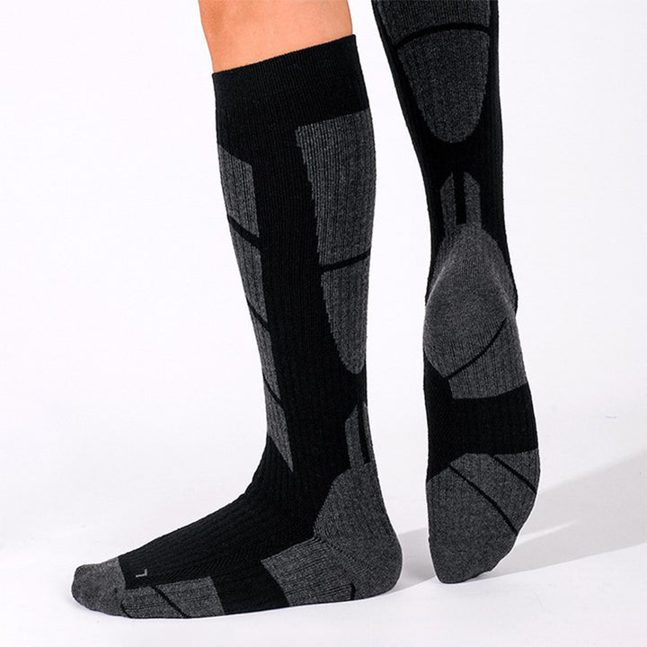 Wearing Black Impact-Absorbing Compression Running Over The Calf Socks-1