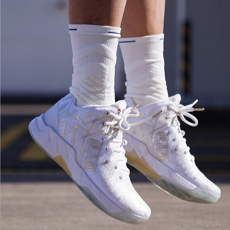 White basketball socks worn with sneakers, offering ankle coverage and breathable comfort.