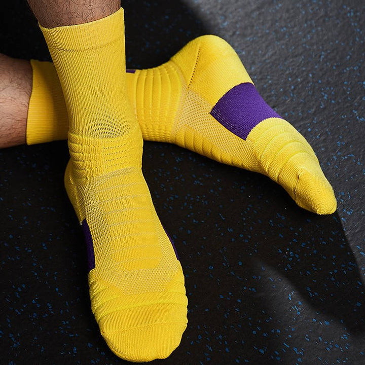 Yellow fitness socks with purple accents, featuring thick padding and a secure fit for active training.