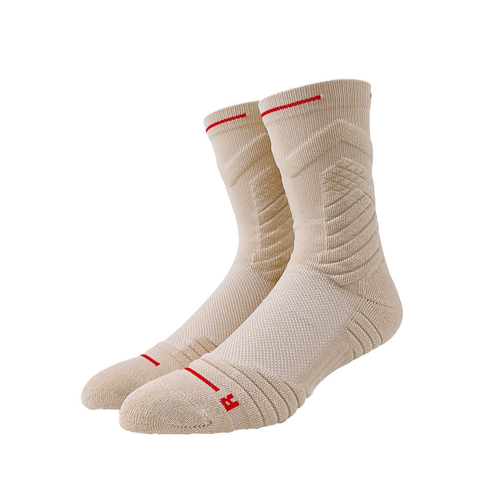 Beige basketball socks with red detailing and rib-knit design for soft support and shock absorption.