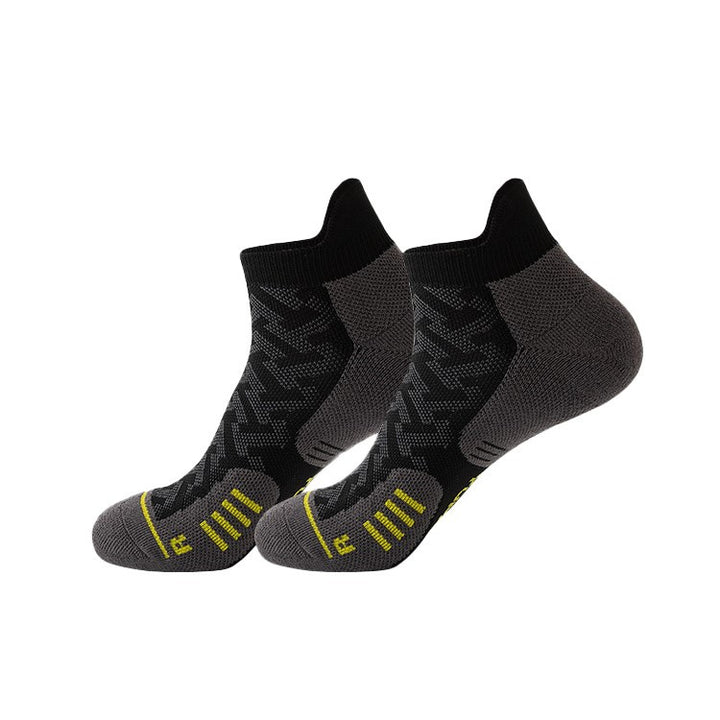 Black running socks with compression fit, providing stability and support for intense runs.