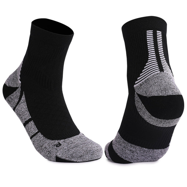 Black and gray cushioned tennis socks with a comfortable fit, designed for stability and performance on the court.