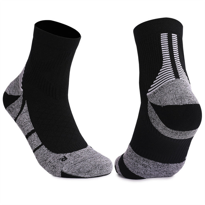 Black and gray cushioned tennis socks with a comfortable fit, designed for stability and performance on the court.