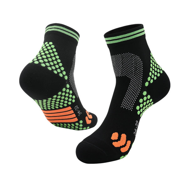 Black and green tennis socks with cushioned footbed and breathable mesh, ideal for court performance.