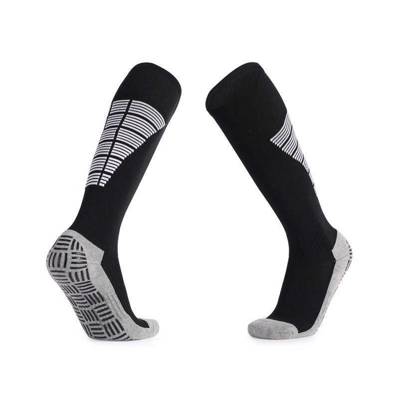 Black and gray soccer grip socks for better traction and stability.
