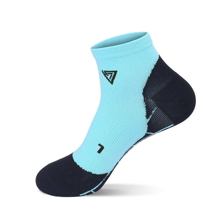 Light blue fitness socks designed for moisture control and ankle support during training.