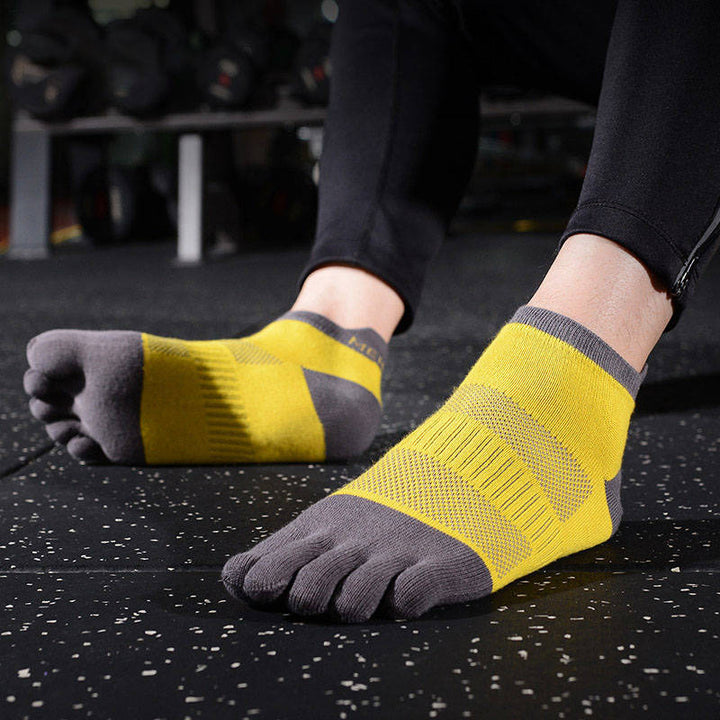 Yellow toe socks for running, providing a snug fit and enhanced comfort for long-distance runs.