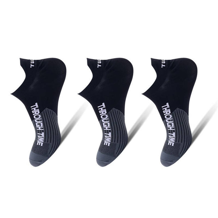 Black running ankle socks with white accents, ideal for performance and stability during exercise.