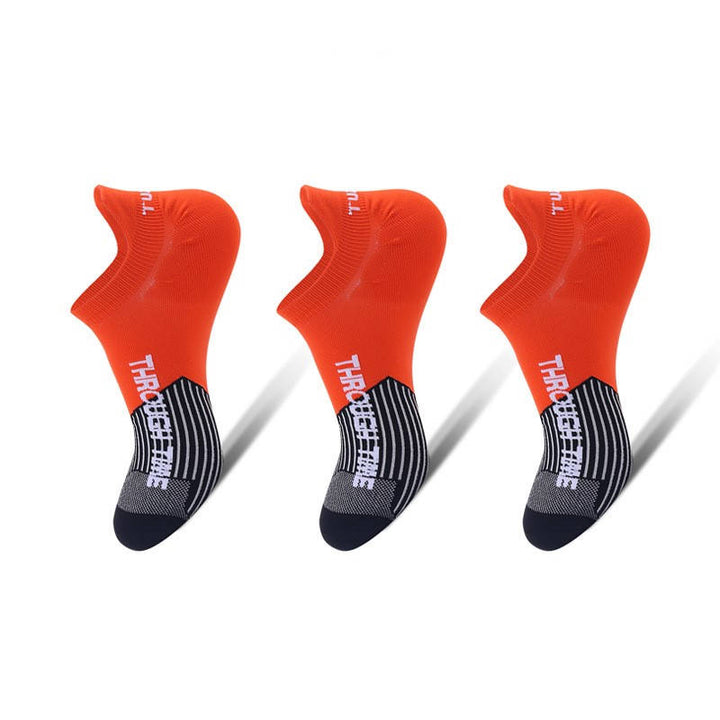 Red running ankle socks with a breathable mesh design, providing comfort and support for intense workouts and running.