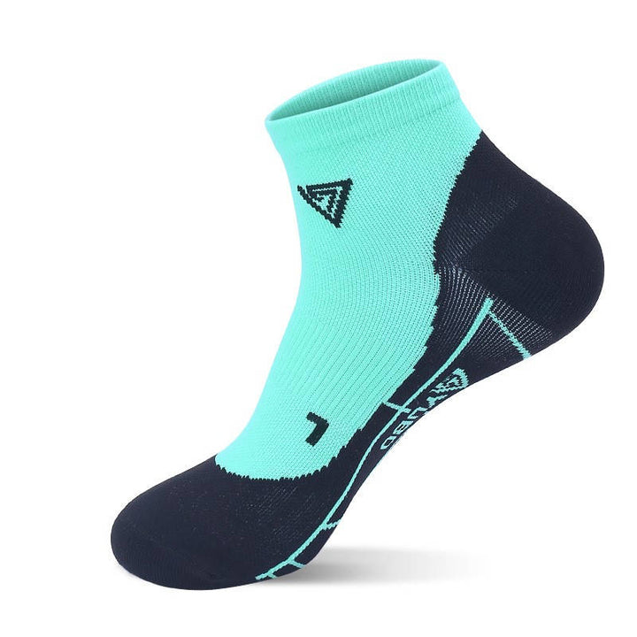 Mint green fitness socks with reinforced heel and arch support for running or gym sessions.