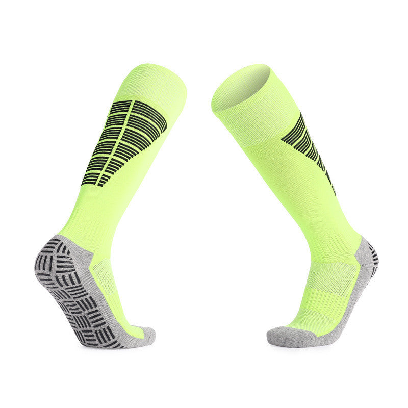 Neon yellow soccer grip socks with extra padding for extended play.