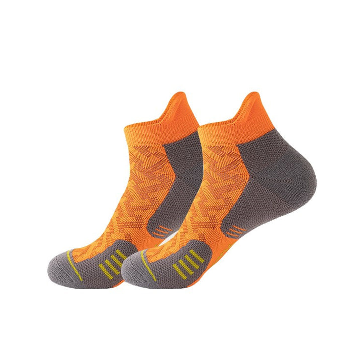 Black and orange running socks featuring padded cushioning and breathable fabric, ideal for high-performance runs.