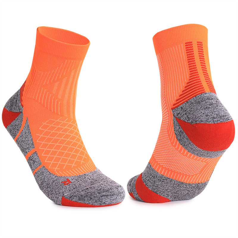 Orange cushioned tennis socks with padded footbed and breathable fabric, providing optimal comfort and support during intense matches.