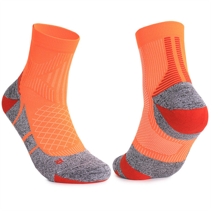 Orange cushioned tennis socks with padded footbed and breathable fabric, providing optimal comfort and support during intense matches.