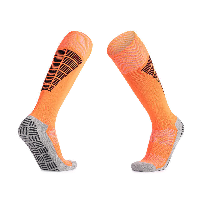 Orange soccer grip socks for added stability and comfort in matches.