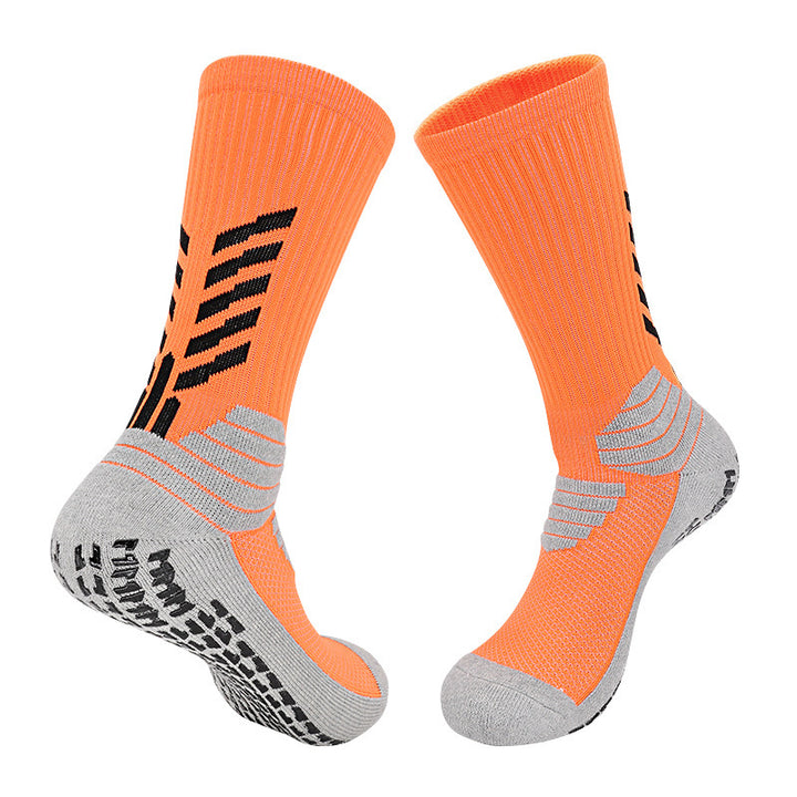 A pair of vibrant orange basketball socks with gray accents, designed with thick cushioning, arch compression, and breathable fabric.
