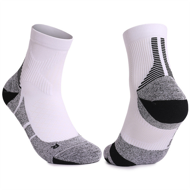 White and gray cushioned tennis socks with moisture-wicking fabric, providing breathability and comfort during matches.