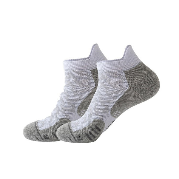 White and gray running socks with cushioned sole and breathable mesh, designed for comfort during long-distance runs.