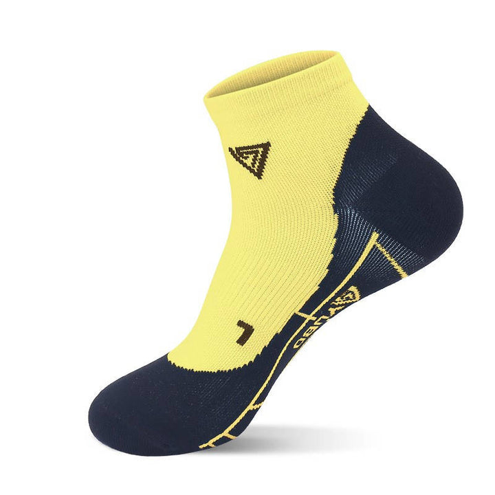 Yellow fitness socks featuring breathable panels and compression fit for intense fitness routines.