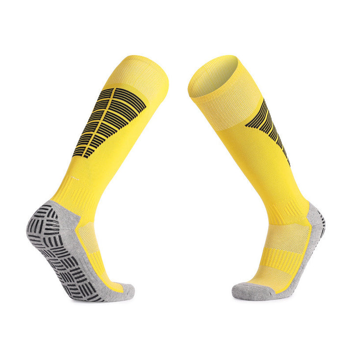 Yellow soccer grip socks with breathable design for cool feet.